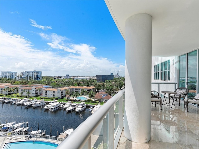 balcony featuring a water view