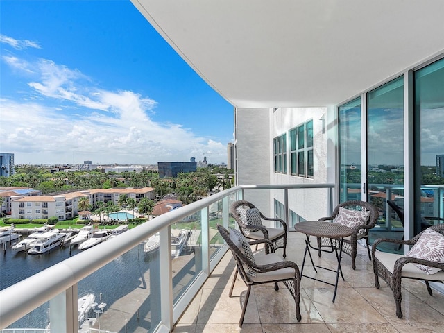 balcony featuring a water view