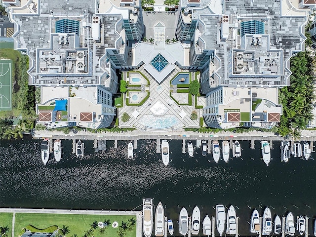 birds eye view of property with a water view