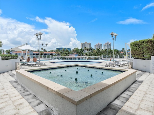 view of swimming pool featuring a patio