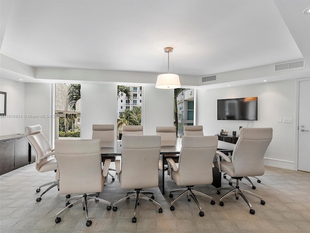 carpeted dining space featuring plenty of natural light