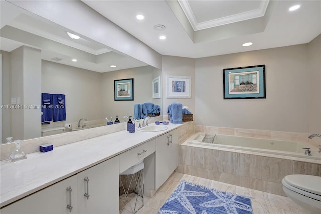 bathroom featuring toilet, vanity, ornamental molding, a bath, and a raised ceiling