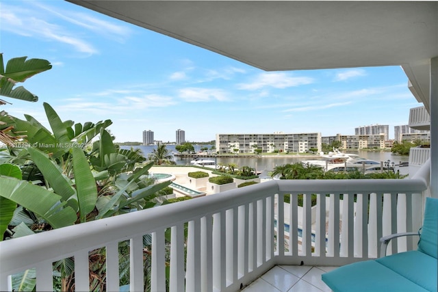 balcony with a water view and a city view