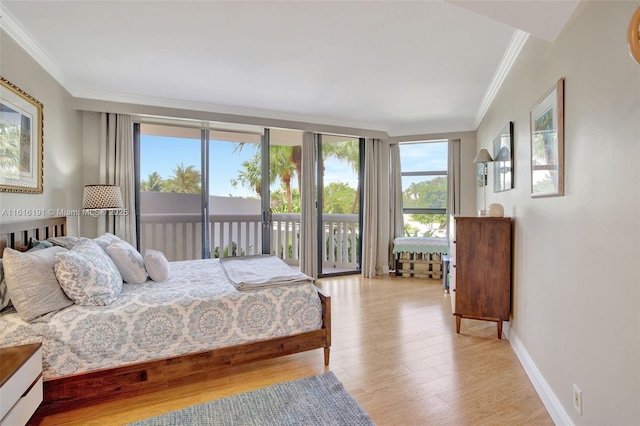 bedroom featuring ornamental molding, access to exterior, light wood-style flooring, and baseboards