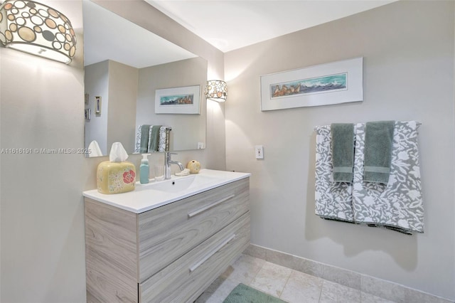 bathroom with vanity and baseboards