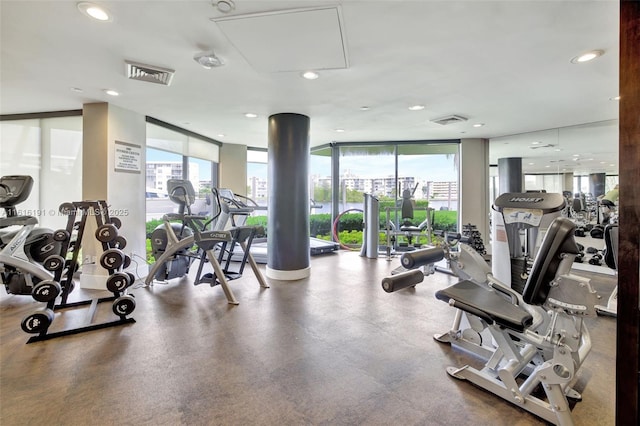 workout area with visible vents, floor to ceiling windows, and recessed lighting