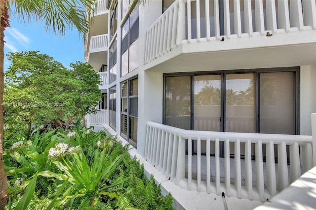 view of side of property featuring stucco siding