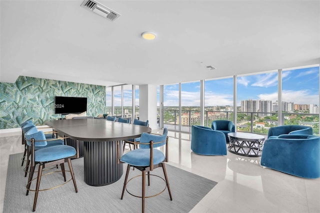 tiled dining area with expansive windows