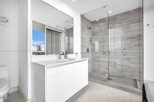 bathroom featuring walk in shower, vanity, and toilet