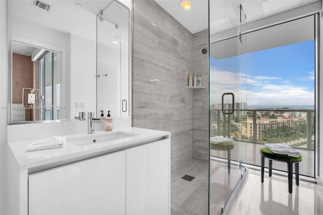 bathroom featuring vanity and a tile shower