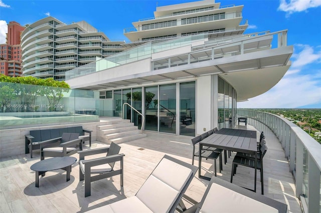 rear view of house with an outdoor hangout area