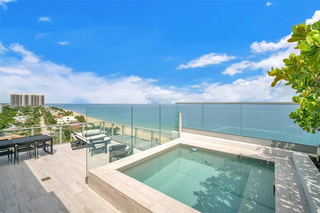 view of swimming pool with a water view