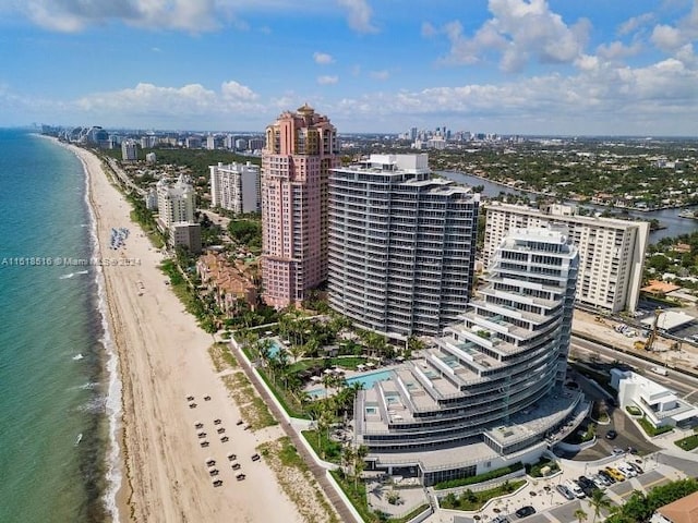 aerial view featuring a view of the beach and a water view