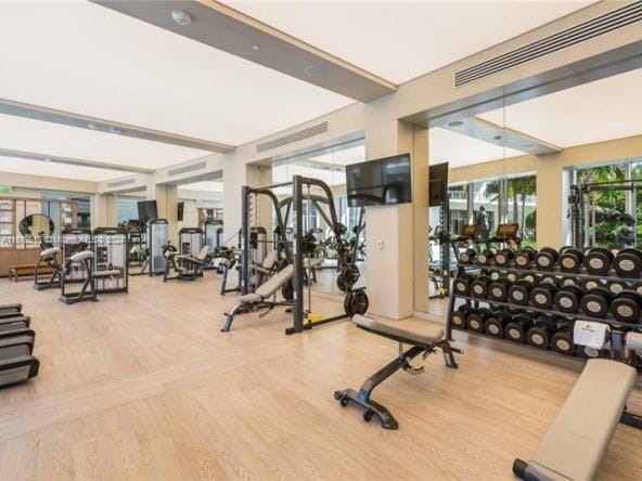 workout area with wood-type flooring