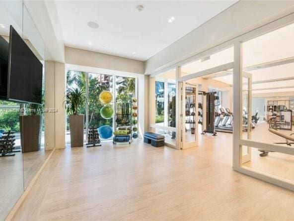 gym with light wood-type flooring