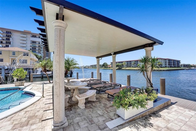 view of patio featuring a water view