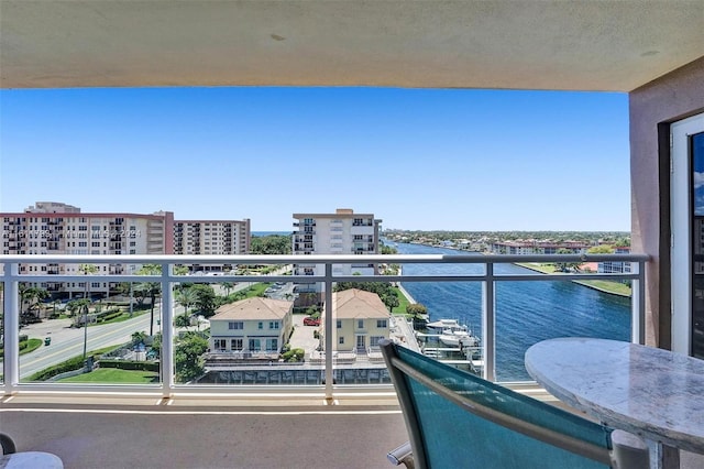 balcony featuring a water view