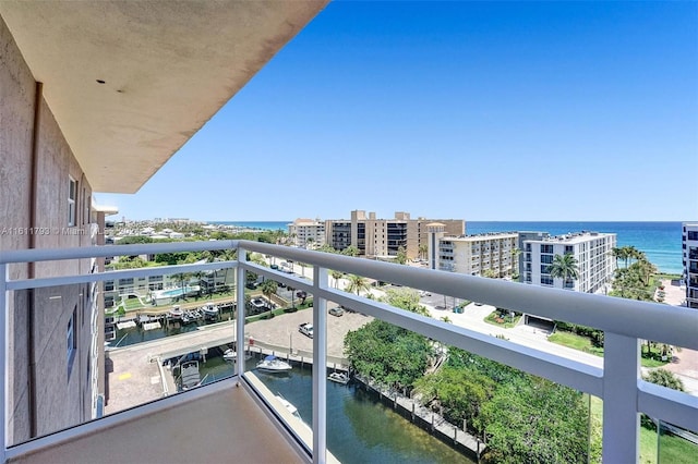 balcony featuring a water view