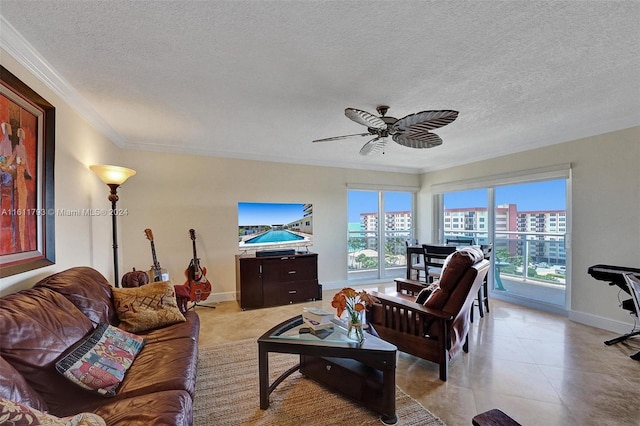 living room featuring light tile patterned floors, a textured ceiling, a wealth of natural light, and ceiling fan