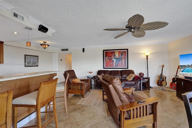 tiled living room featuring ornamental molding, a textured ceiling, and ceiling fan