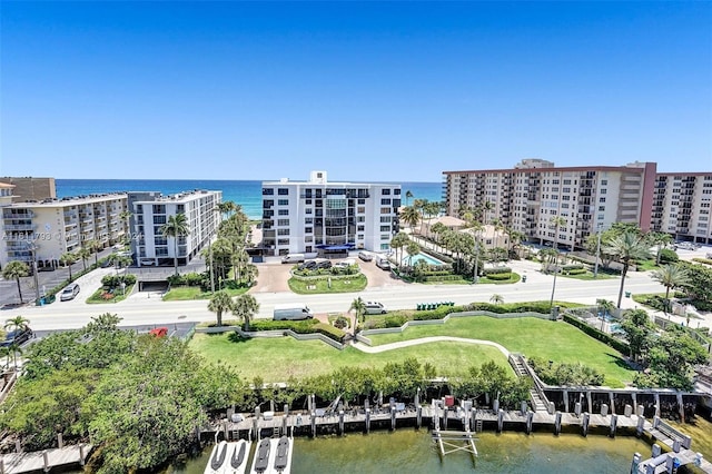 birds eye view of property with a water view