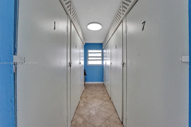 hallway with light tile patterned floors