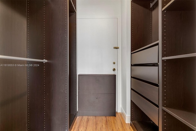 spacious closet featuring light hardwood / wood-style floors