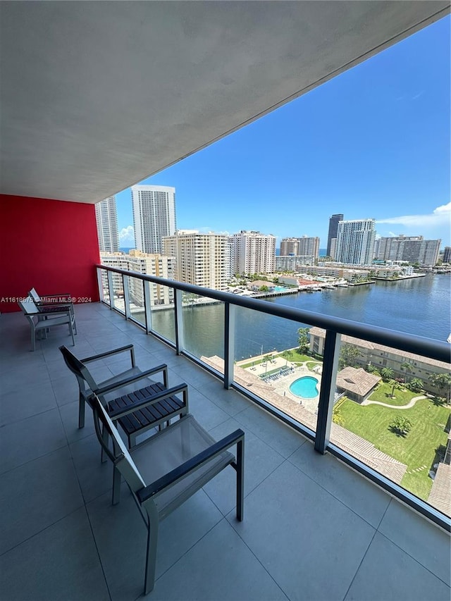 balcony featuring a water view