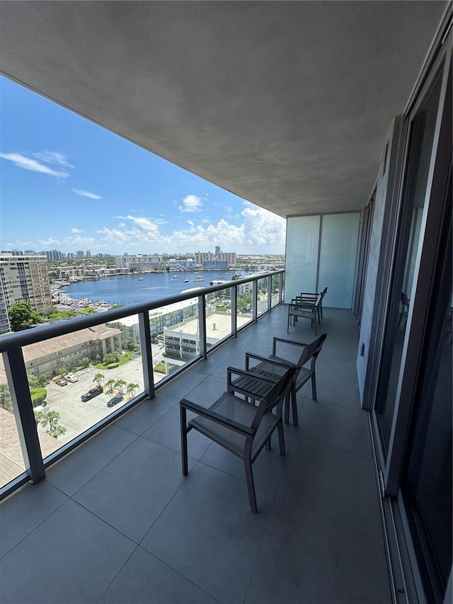 balcony featuring a water view