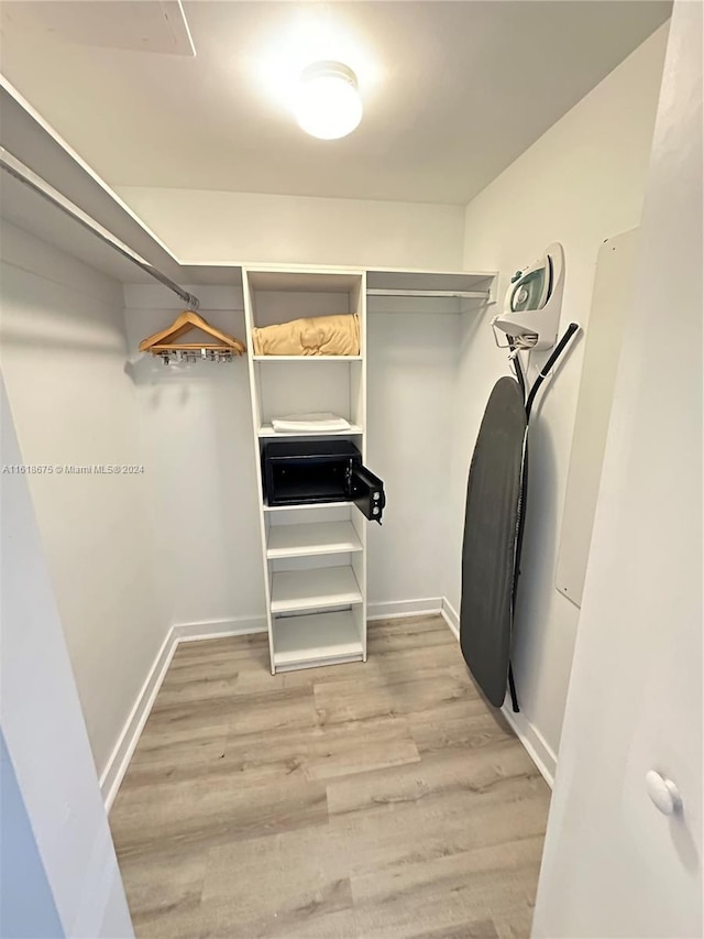 spacious closet featuring hardwood / wood-style flooring