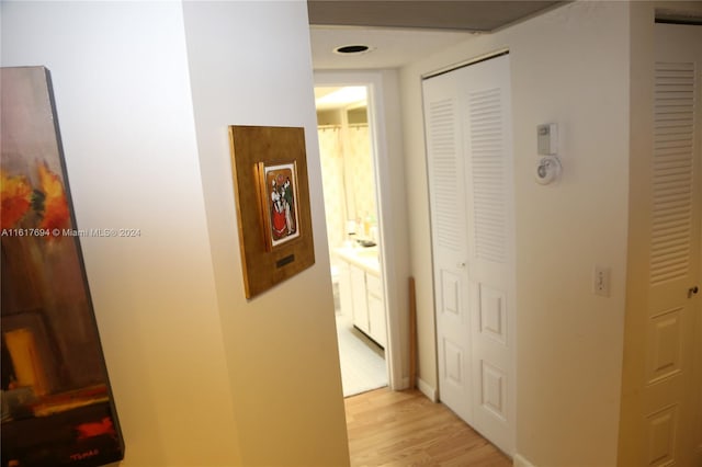 hallway featuring light hardwood / wood-style flooring