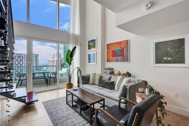 tiled living room with a towering ceiling