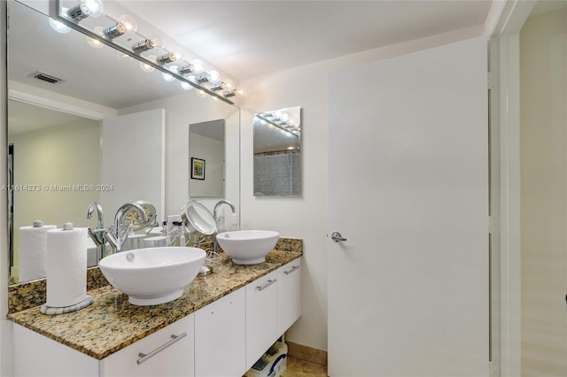 bathroom featuring double sink vanity