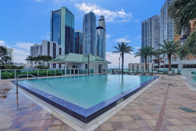 view of pool featuring a patio