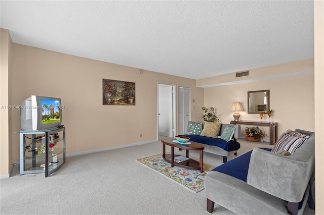 living room with light carpet and a textured ceiling