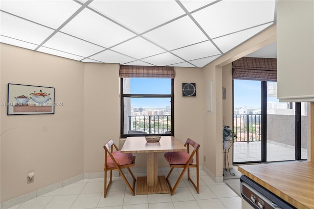 dining space featuring light tile patterned floors