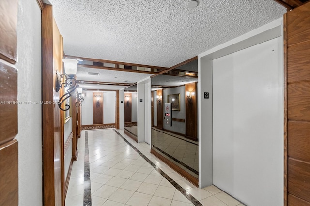 hall with light tile patterned floors