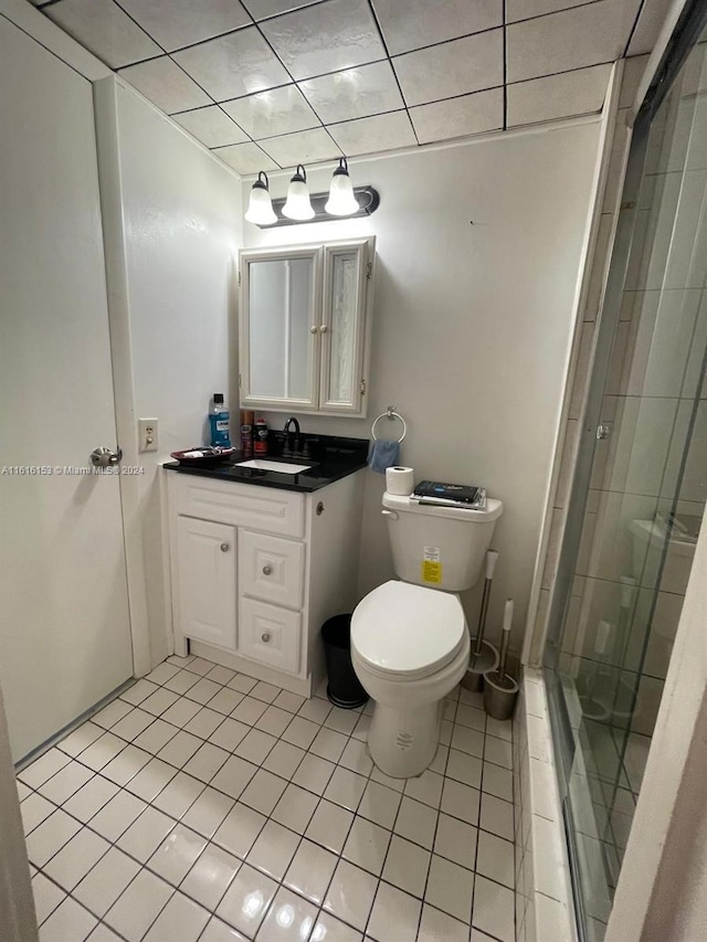 bathroom with vanity, tile patterned flooring, and toilet