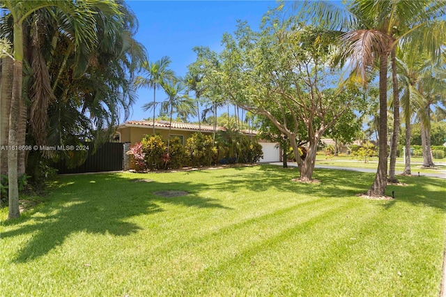1154 Jefferson St, Hollywood, FL 33019 - view of yard featuring an attached garage