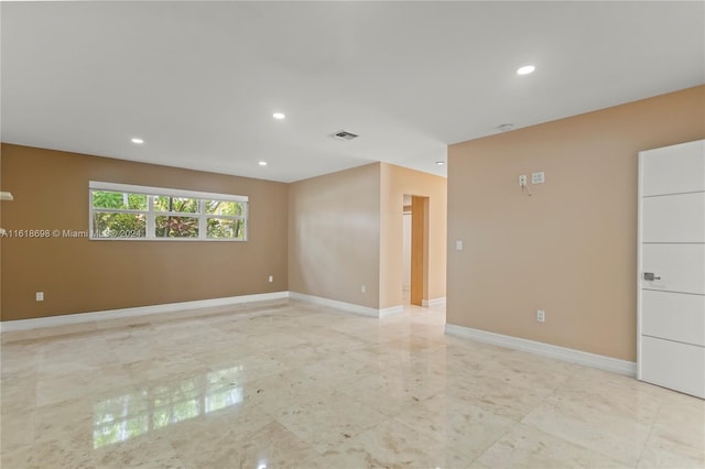 1154 Jefferson St, Hollywood, FL 33019 - empty room featuring recessed lighting, visible vents, marble finish floor, and baseboards