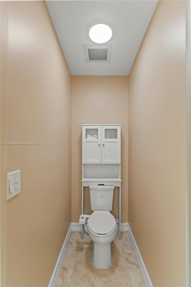 1154 Jefferson St, Hollywood, FL 33019 - bathroom featuring baseboards, toilet, tile patterned flooring, and visible vents