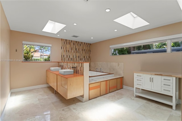 1154 Jefferson St, Hollywood, FL 33019 - full bath with recessed lighting, a bath, a skylight, and baseboards