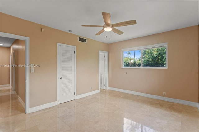 unfurnished bedroom with ceiling fan