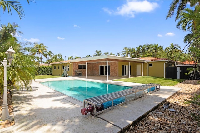 view of swimming pool featuring a patio area