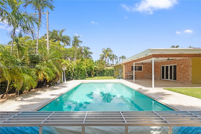 view of swimming pool with a patio area