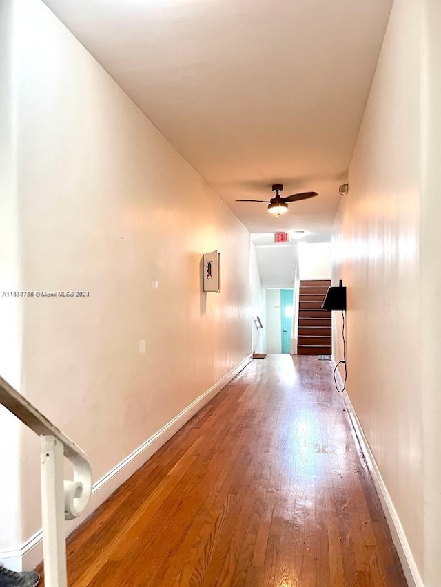 hallway featuring wood-type flooring