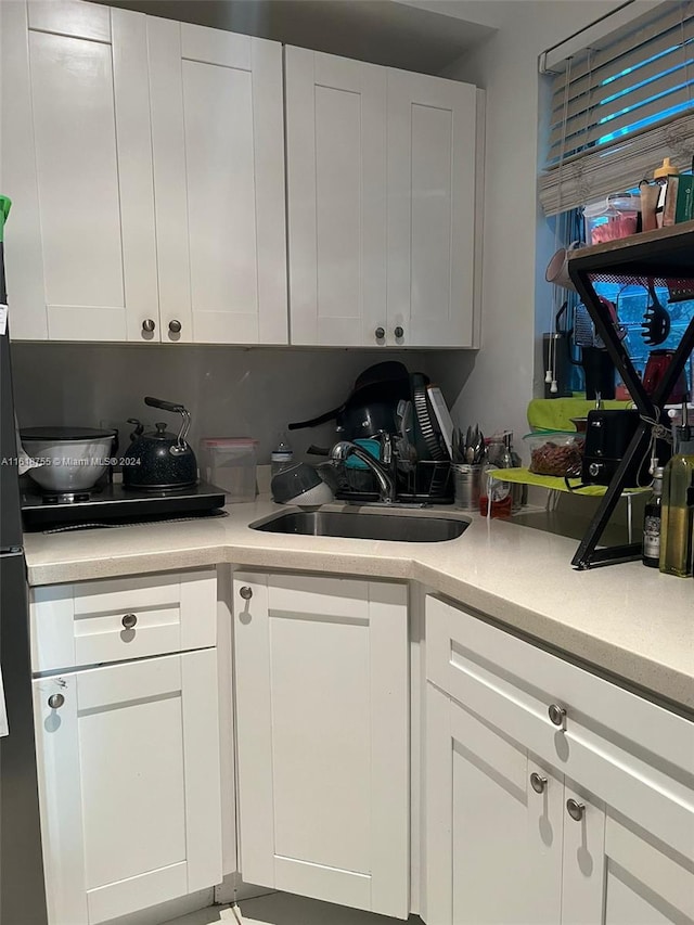 kitchen with sink and white cabinets