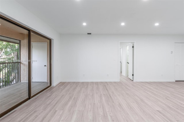 spare room with light wood-type flooring