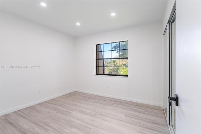 empty room with light wood-type flooring