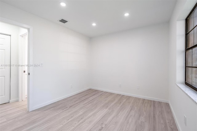 unfurnished room featuring light hardwood / wood-style flooring